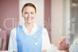 Portrait of happy beautiful nurse at home