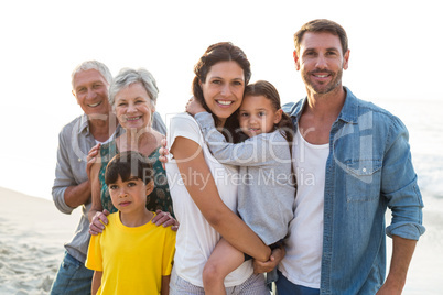 Happy family posing at the beach