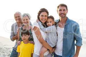 Happy family posing at the beach