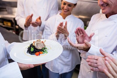 Team of chefs applauding