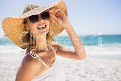 Portrait of blonde woman with straw hat