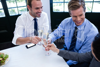 Businessmen toasting with champagne
