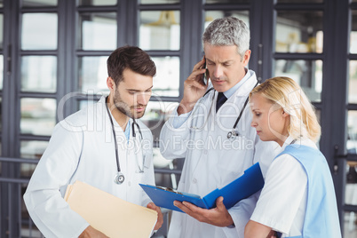 Senior doctor working with coworkers