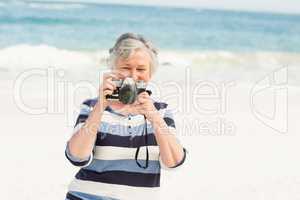 Senior woman taking picture