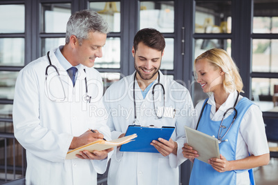 Senior doctor discussing with coworkers