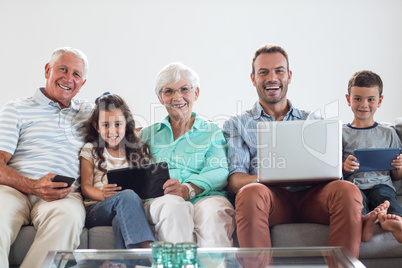 Happy family sitting on sofa