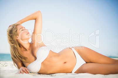 Relaxed woman posing at the beach