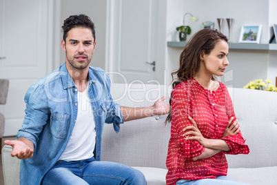 Portrait of man while arguing with woman