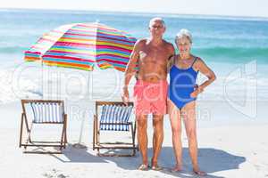 Cute mature couple posing on the beach