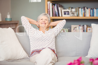 Senior woman relaxing on sofa