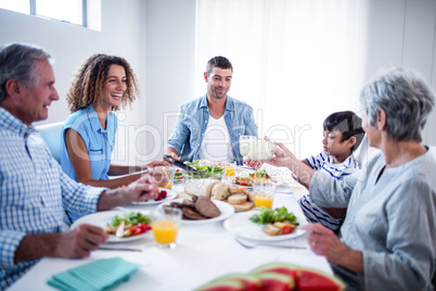 Happy family having breakfast together