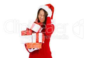 Woman in christmas attire holding gifts
