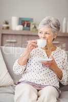 Senior woman having coffee