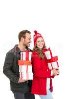 Young couple holding gifts