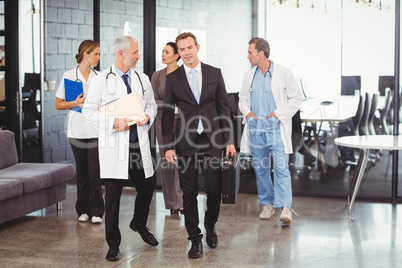 Medical team interacting each other while walking together