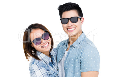 Happy young couple smiling at camera