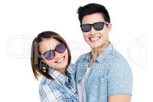 Happy young couple smiling at camera