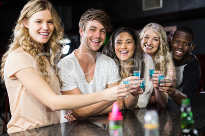 Group of friends having shots