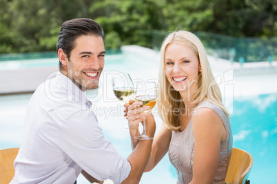 Portrait of smiling couple drinking wine