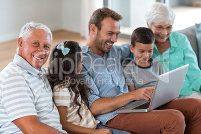 Happy family sitting on sofa