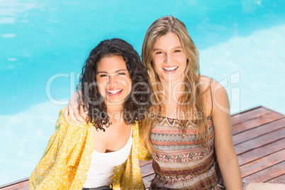 Portrait of young women having fun near pool