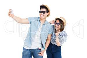 Happy young couple taking a selfie