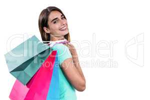 Portrait of hapy woman holding shopping bags