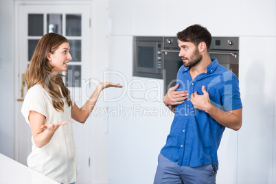 Woman arguing with partner in kitchen