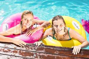 Happy friends enjoying in the swimming pool