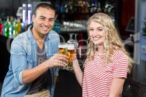 Smiling couple drinking beer