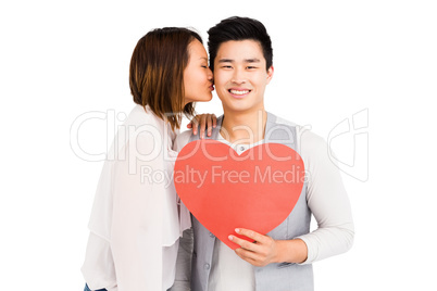 Woman kissing man on cheek