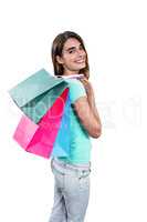 Portrait of cheerful woman holding shopping bags
