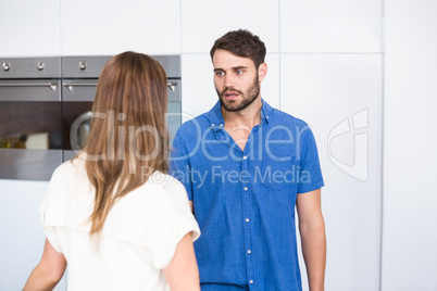 Man looking at wife while arguing