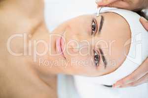 Close-up portrait of woman receiving facial massage