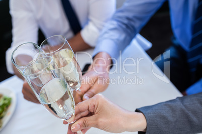 Hands toasting with champagne