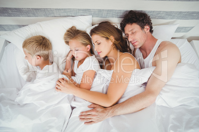 High angle view of family sleeping