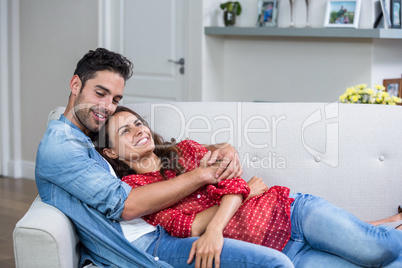 Romantic couple hugging at home