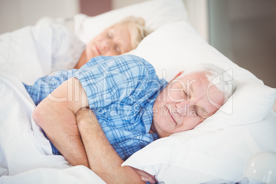 Senior couple sleeping on bed Senior couple sleeping on bed