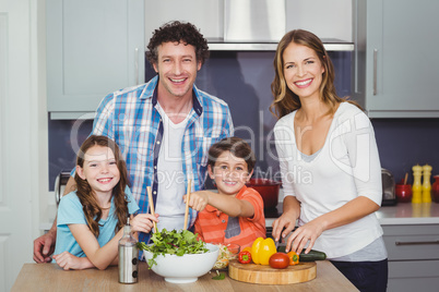Portrait of happy family in kitchen