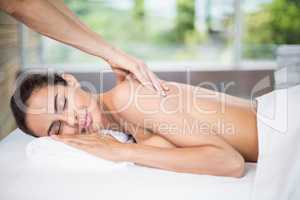 Young woman enjoying back massage