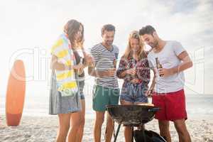 Happy friends preparing barbecue