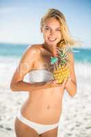 Woman holding a pineapple