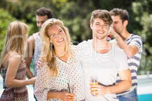 Young couple smiling and having juice together