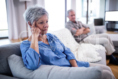 Upset senior couple ignoring each other