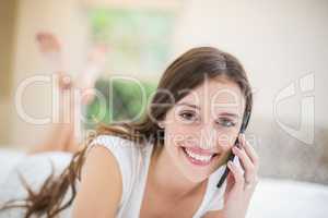 Portrait of smiling woman talking on mobile phone