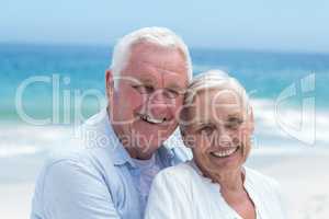Senior couple embracing at the beach