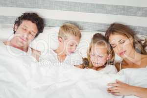 High angle view of family sleeping