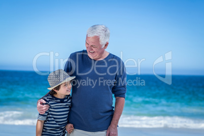 Cute boy embracing his grandfather