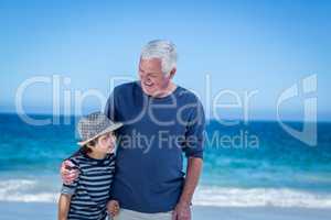 Cute boy embracing his grandfather