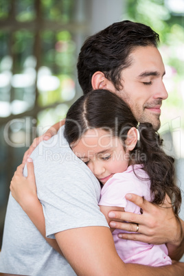 Daughter hugging father